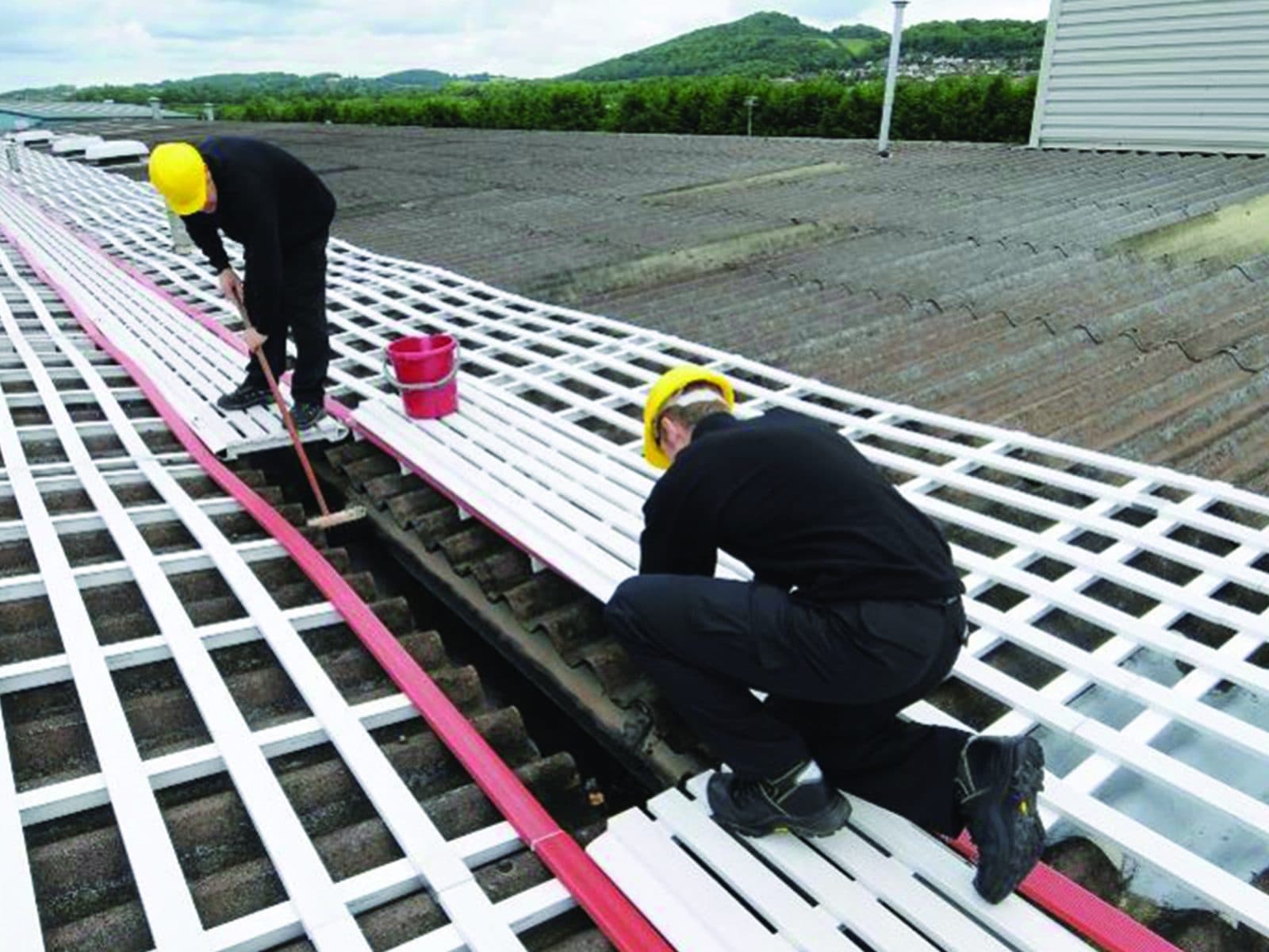 Fall-Proof roof light covers installed on a flat roof